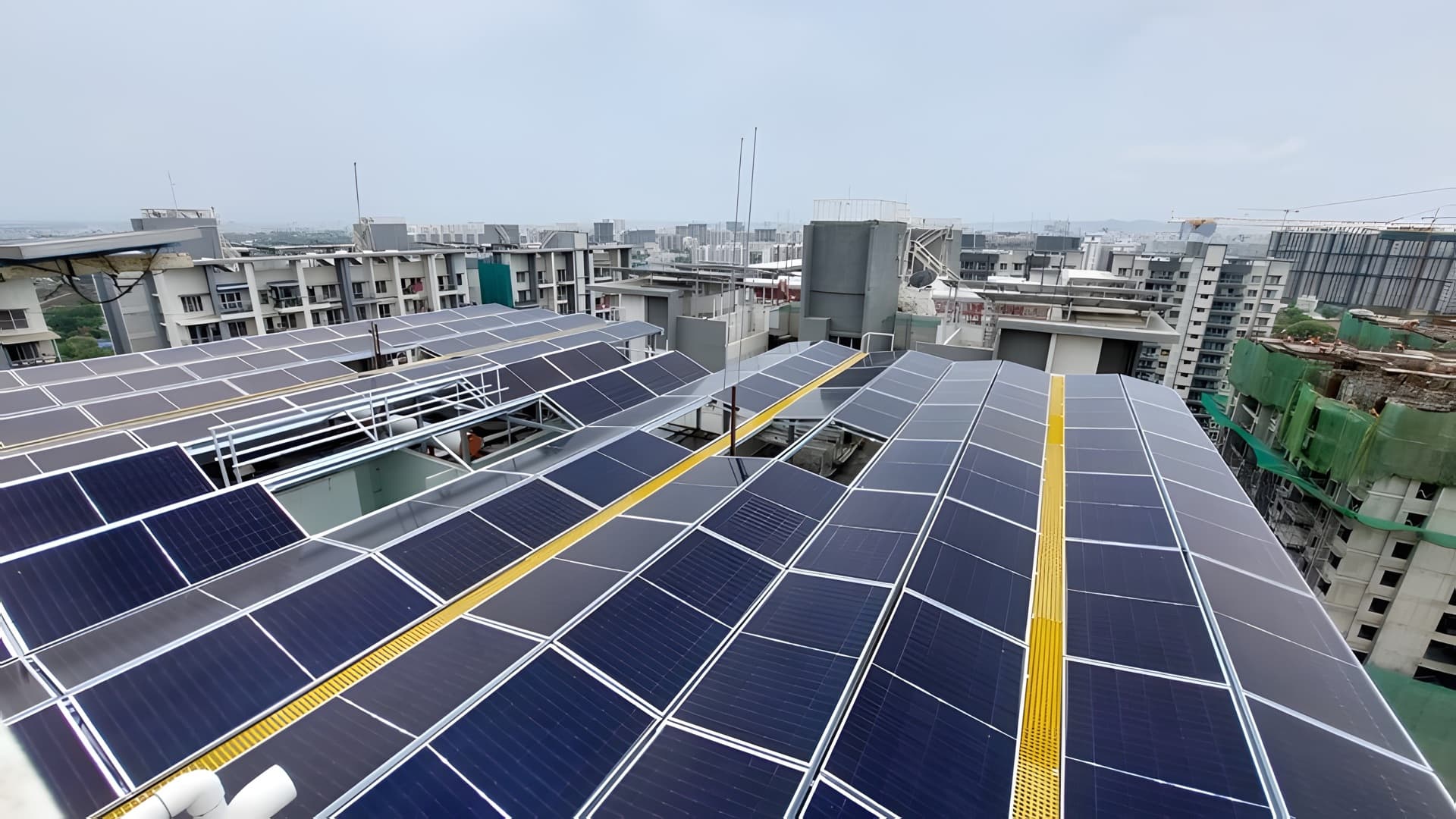 One shared rooftop solar plant across the terrace of 7 Plumeria Drive, Pune